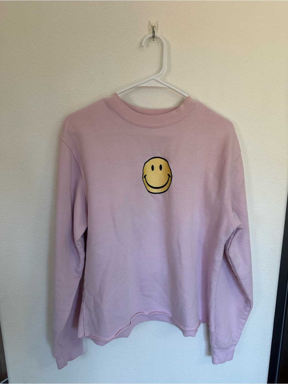 Pastel Pink Crewneck Sweatshirt with Yellow Smiley Patch